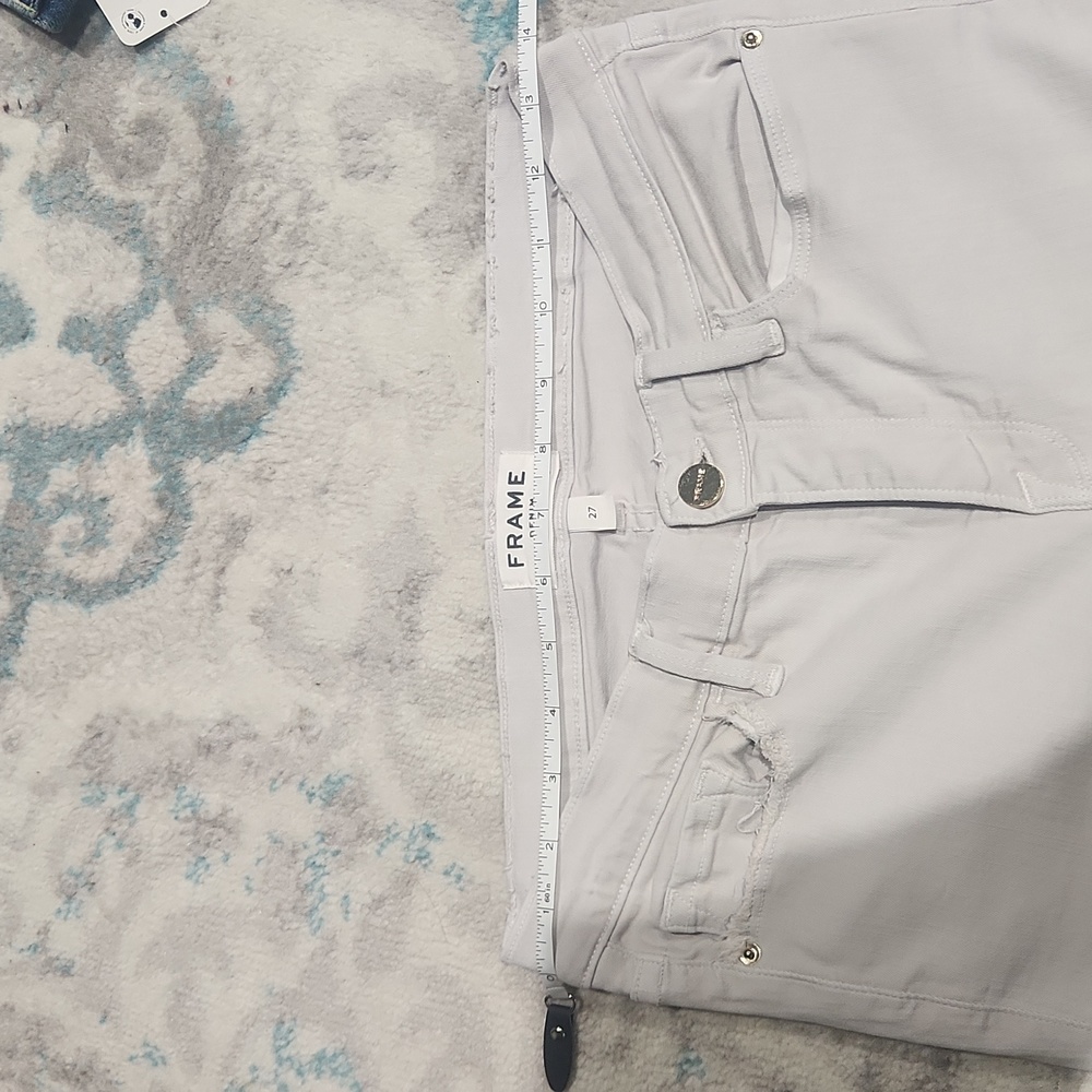 Frame grey denim pants small hole on right back pocket pointed out. Runs small